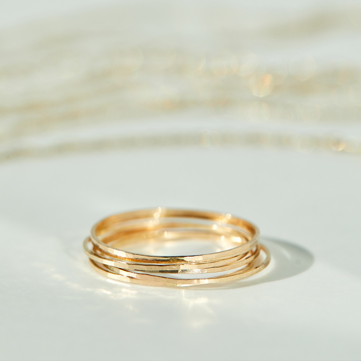 Catbird Threadbare gold stacking rings, multiple delicate 14K gold bands stacked together